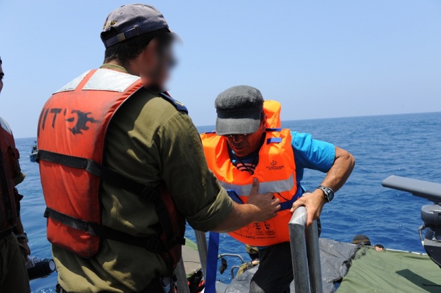 IDF Navy Soldiers Help Al-Karama Passengers board IDF Navy Vessel
